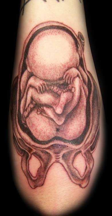 Uterus tatoo. Baby fetus tatoo.